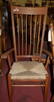 Lot 1364 - An Arts & Crafts oak stickback and rush seat...