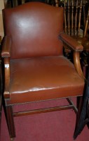 Lot 1369 - A mahogany and studded tan leather upholstered...