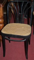 Lot 1370 - A set of nine black painted bentwood caneseat...