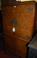 Lot 1197 - A reproduction figured walnut four door...