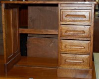 Lot 1382 - A 1930s oak single pedestal writing desk of...