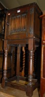 Lot 1393 - An oak linenfold single door pot cupboard