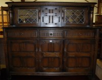 Lot 1395 - A moulded oak court cupboard