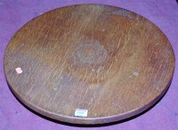 Lot 1399 - An early 20th century circular oak lazy-Susan,...
