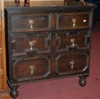 Lot 1409 - A geometric moulded oak chest of two short...