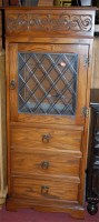 Lot 1411 - A moulded oak hinge-top HiFi cabinet, having...
