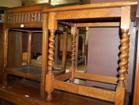 Lot 1420 - A moulded oak single drawer two tier side...