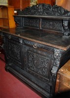 Lot 1428 - A late 19th century heavily carved and...