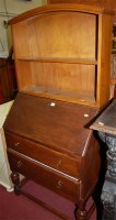 Lot 1429 - A 1930s oak slopefront two drawer writing...