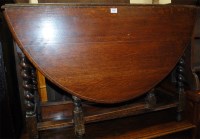 Lot 1436 - An early 20th century barleytwist oak dropleaf...