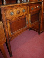 Lot 1437 - An early 20th century ledgeback moulded oak...