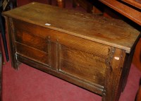 Lot 1244 - An antique joined oak twin panelled hinge-top...
