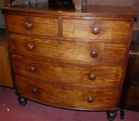 Lot 1446 - An early 19th century mahogany bowfront chest...