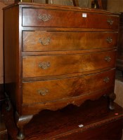 Lot 1452 - A reproduction figured walnut bowfront chest...