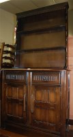 Lot 1454 - A moulded dark elm kitchen dresser, w.90cm