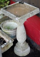 Lot 1460 - A reconstituted stone pedestal bird bath