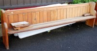 Lot 1462 - Two late Victorian stained pine church pews of...