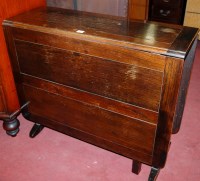 Lot 1442 - A 1930s oak dropleaf dining table, having...