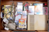Lot 3231 - A boxed Commodore 64C, with a quantity of...
