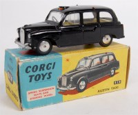 Lot 1650 - Corgi Toys, 418 Austin FX4 taxi, black body...