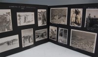 Lot 338 - An album of WW II photographs with hand...