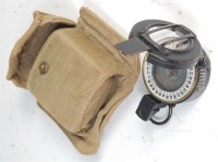 Lot 388 - A WW II brass cased prismatic compass, stamped...