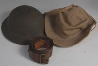 Lot 407 - A WWII Brodie pattern steel helmet, having a...
