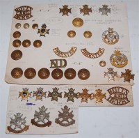 Lot 455 - A collection of military cap badges and...