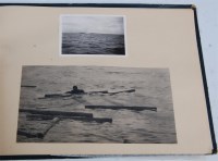 Lot 458 - An album of WW II photgraphs and ephemera to...