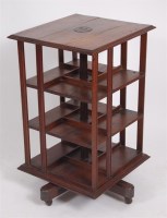Lot 450 - An oak and pine three tier revolving bookcase...