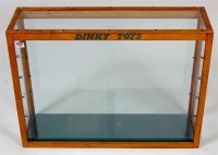 Lot 1980 - Dinky Toys, glass display case, oak framed...