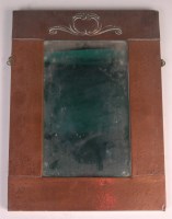 Lot 78 - An Arts & Crafts copper framed wall mirror,...