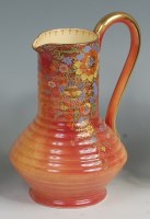 Lot 16 - A 1930s Crown Devon orange lustre single...