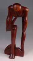 Lot 104 - A contemporary carved hardwood figure of a...