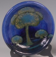 Lot 130 - A Moorcroft Moonlit Blue pattern shallow...
