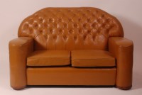 Lot 261 - An Art Deco tan leather buttonback two-seater...