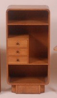Lot 267 - An Art Deco round cornered oak open bookshelf,...