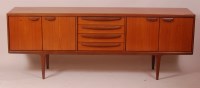 Lot 284 - A 1960s G-Plan teak long sideboard, having...