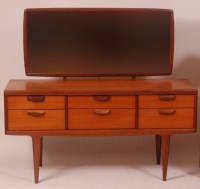 Lot 285 - A 1960s G-Plan teak dressing chest, having...