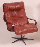 Lot 287 - A Danish 1960s laminate framed open armchair...