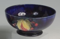 Lot 134 - A William Moorcroft Anemone pattern circular...