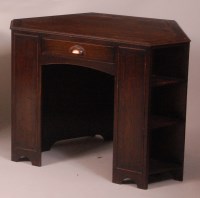 Lot 270 - An Art Deco oak and brown leather topped...