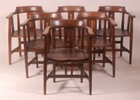 Lot 271 - A set of six Arts & Crafts oak panelled seat...
