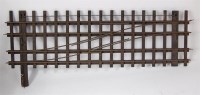 Lot 573 - A GI clockwork crossover on wooden sleepers (F)