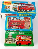 Lot 3157 - 2 tinplate buses and a plastic example with...