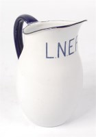 Lot 103 - An LNER enamel water jug with large lettering,...