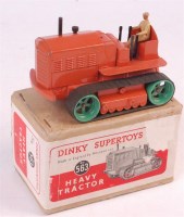 Lot 1958 - Dinky Toys, 563 heavy tractor, orange body,...