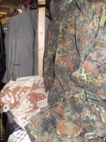Lot 590 - A flight suit, a tank suit, a Desert Storm...