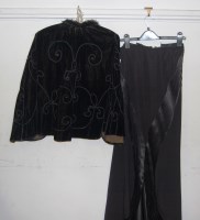 Lot 721 - An Edwardian black silk crepe skirt with satin...