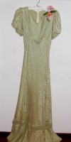 Lot 725 - A late 1930s watered pale green silk dress...